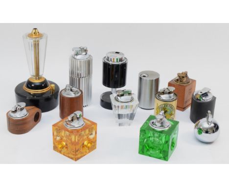 A collection of mid 20th century and later table cigarette lighters, petrol and gas filled. 