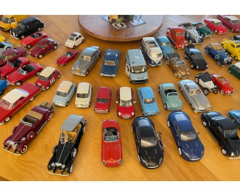 A large quantity of assembled plastic scale model cars to include several VW Beetles, a Mini and a Jägermeister Porsche 