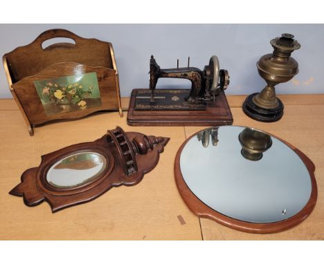An early 20th century 'Bradbury &amp; Family' cased manual operated sewing machine, together with a brass oil lamp, magazine 