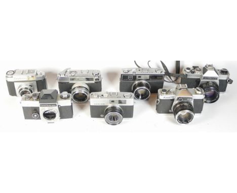 Seven SLR vintage film cameras to include a Mamiya Super Deluxe, a Yashica Minister 700, a Chinon CS and a Contina Zeiss Ikon