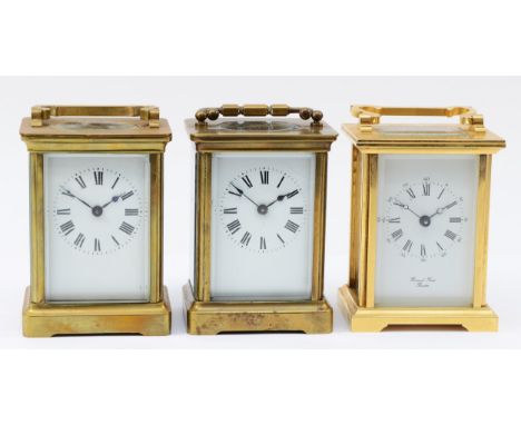 An English brass cased 8 day carriage clock, circa 1980s, together with two French examples. (3) 