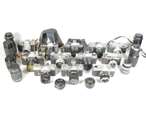 Thirteen SLR vintage film cameras to include a Yashica FX-7, a Praktica Super TL, a Zenit E and a Ricoh 500g. Together with e