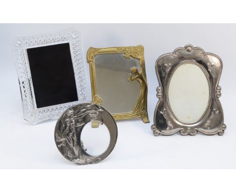 An Art Nouveau style brass dressing table mirror, 23x17cm, together with a circular plated picture frame, a Waterford crystal