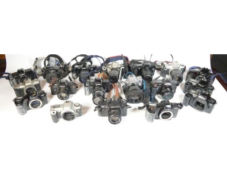 Twenty four SLR vintage film cameras to include a Canon EOS 500N, a canon EOS 3000, a Minolta 7000i and a Praktica BC1 