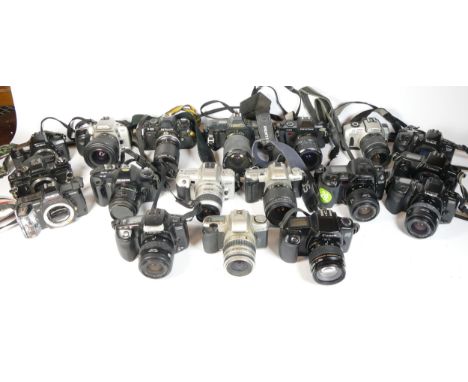 Thirty SLR vintage film cameras to include a Pentax P30, a canon EOS 1x7, a Minolta 505si, and a Nikon F-301 