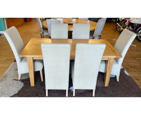 A modern solid light oak dining suite, comprising rectangular top table on square tapered legs, with a set of six high back d