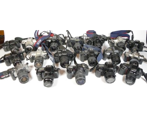 Twenty five SLR vintage film cameras to include a Nikon F65, a Canon T70, a Canon EOS 300 and a Minolta 404si 