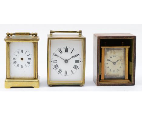A French miniature brass carriage clock, of square form with enamelled dial and Roman numerals, housing 8 day movement on bra