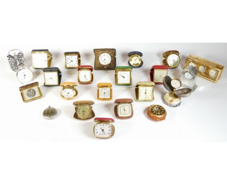 A collection of miniature novelty clocks, together with traveling alarm clocks, having quartz and manual movements. 