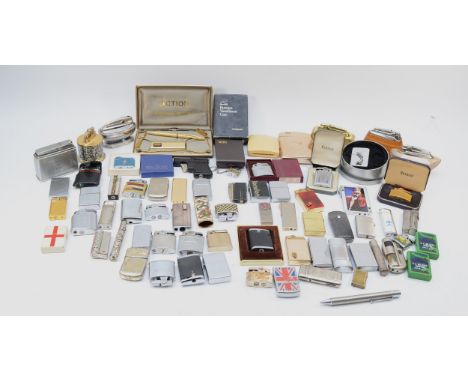 A collection of mid 20th century and later pocket and table cigarette lighters, petrol and gas filled. 