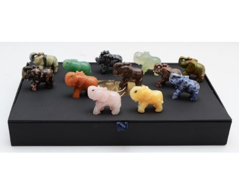 A set of twelve hand carved gemstone, crystal and jade elephants, 4cm tall, complete in presentation case.