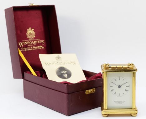 A modern Winegartens Ltd English brass case carriage clock, having 8 day movement, complete with presentation box. 