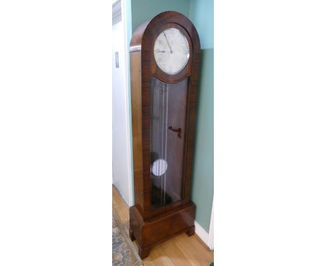 A mid 20th century Art Deco longcase clock, mahogany and walnut veneered case, the arched top with painted dial stamped GB, c