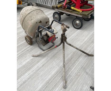 A cement mixer with Honda G100 2.5 petrol engine on stand. 