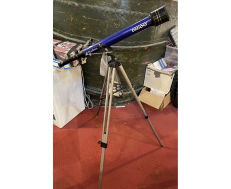 A modern Tasco 'Galaxsee' telescope on adjustable trypod, with accessories and instruction manual. 