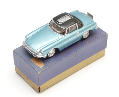 A 1960s table lighter in the form of a MG sports car, made in Japan, the painted metallic blue diecast body housing a semi au