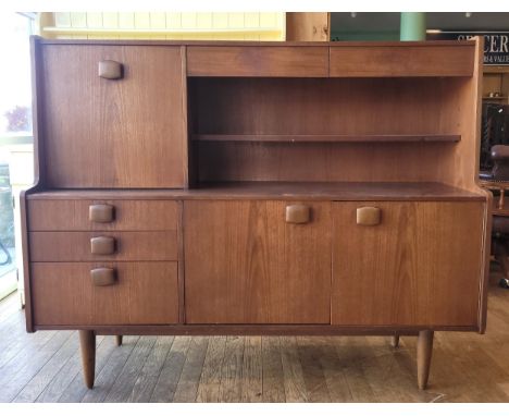 Stonehill Furniture: A mid 20th century teak sideboard/drinks cabinet.W152, H121, D45cm. 
