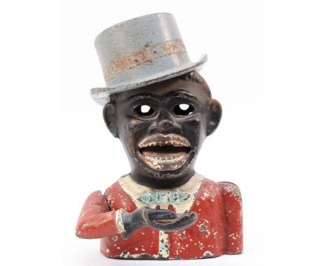 A painted cast metal 'Jolly Boy' mechanical money bank, depicted wearing a silvered top hat, 17cm tall. These items are liste