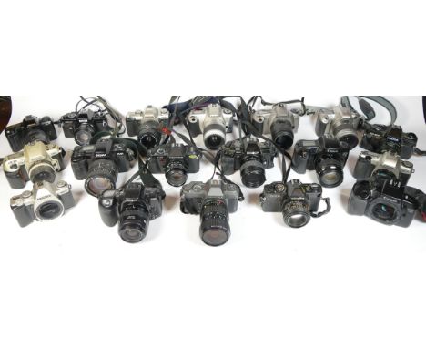 Twenty four SLR vintage film cameras to include a Pentax MZ-M, a Minolta 300si, a Carena 100sx and a Canon EOS 500n 