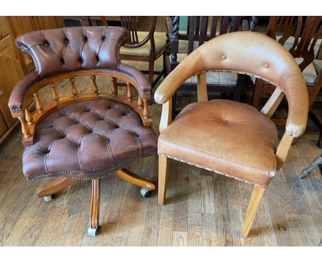 A mid 20th century Chesterfield style captains swivel armchair, having button back backrest over smokers bow with manchettes,