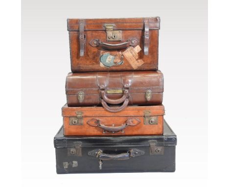 An early 20th century brown leather case, with leather straps and  handle, bearing a label for Army &amp; Navy Co-operative S