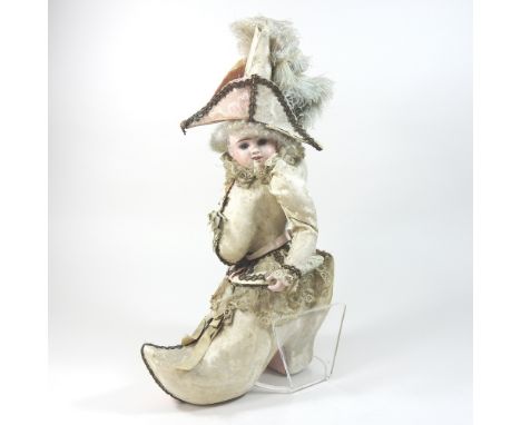 A rare and unusual 19th century French Etienne Denamur bisque headed Boissier chocolate box doll, in the form of a child dres