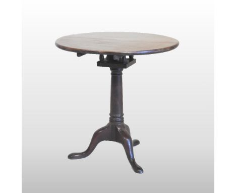 A George III mahogany occasional table, the hinged circular top with a birdcage action, on a turned column and tripod base, 6