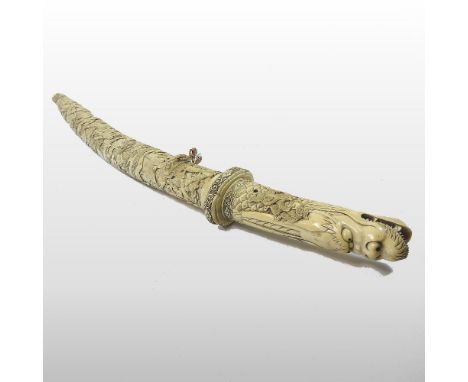 A late 19th century Japanese carved bone ceremonial short sword, Meiji Period, the sectional handle, tsuba and scabbard all c