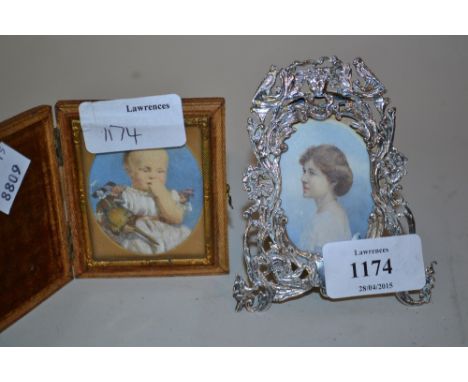 Small London silver floral and bird decorated photograph frame housing an early 20th Century miniature head and shoulder port