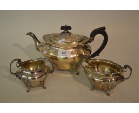 Silver three piece tea service of oval baluster fluted design with scroll feet and handles, Sheffield 1901