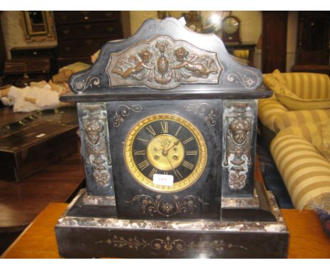 Large Victorian black slate and flecked marble two train mantel clock with visible escapement and metal mounts
