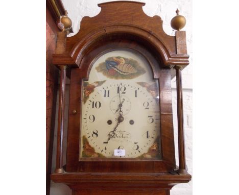 Early 19th Century oak longcase clock with an arched hood above a rectangular panelled door and a shaped plinth base, the pai