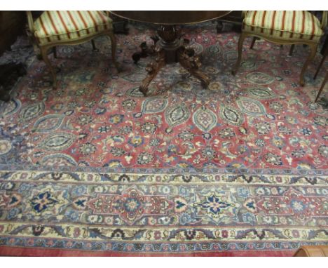 Large 20th Century Meshed carpet with medallion and all-over stylised floral design on a red ground with borders, 13ft x 9ft 