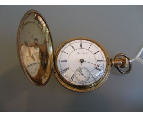 14ct Gold plated full hunter pocket watch having enamel dial with Roman numerals and subsidiary seconds, inscribed Rockford
