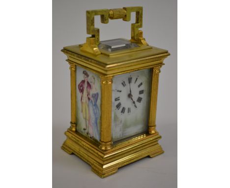 Early 20th Century miniature gilt brass cased carriage clock, the moulded case with corner pilasters and shaped carrying hand