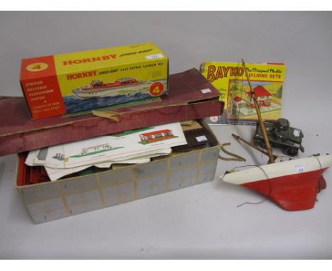 Hornby model IV clockwork speed boat in original box, small model pond yacht, tin plate toy tank, a boxed Tip Kick football g