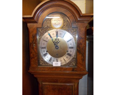 Mid 20th Century walnut Grandmother clock with broken arch hood above a moulded trunk and conforming plinth base, the brass d