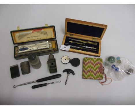 Cased set of drawing instruments, small hand signalling mirror, a monocular lens and other various small collectables includi