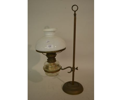 Early 20th Century brass adjustable oil lamp with clear glass well and opaque glass shade (lacking chimney)