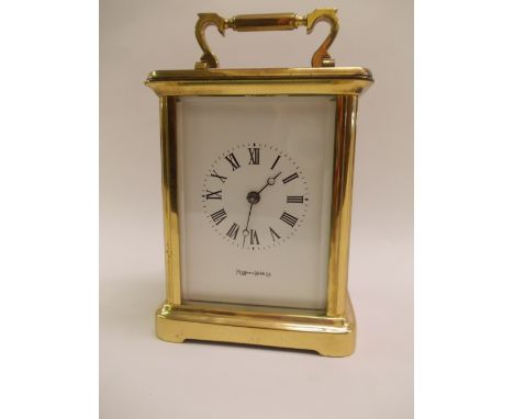 Large gilt brass cased carriage clock with enamel dial having Roman numerals by Mappin and Webb Limited