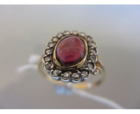 15ct Gold, cabochon, amethyst and diamond chip set ring with pierced shoulders