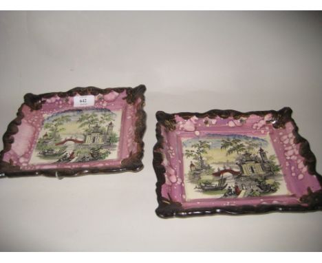 Pair of 19th Century rectangular pottery pink lustre wall plaques printed with Chinese river landscapes together with an Ayns
