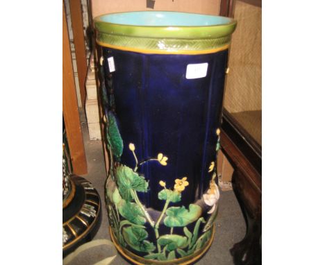 George Jones Majolica stick stand decorated in relief with water lilies, fishes and yellow flowers on a cobalt blue ground, p