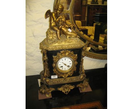 19th Century French ormolu and slate mantel clock mounted with a figure of a seated winged cherub with a young girl holding a