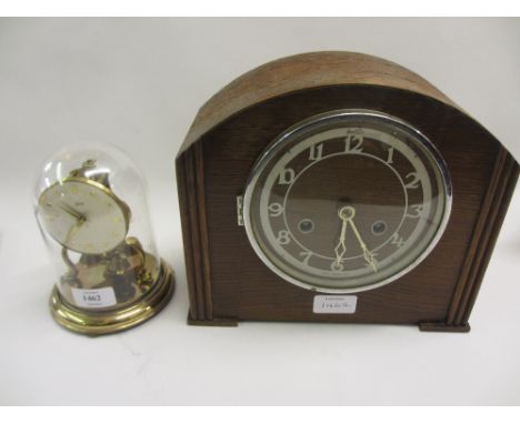 Small brass three hundred day clock under a dome together with a 1930's oak two train mantel clock