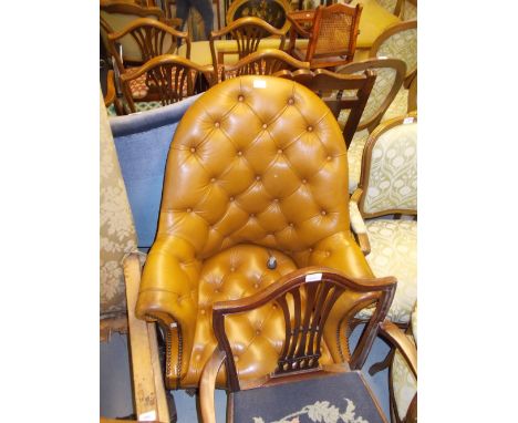 20th Century tan button leather upholstered tub shaped revolving office chair on splay reeded supports with casters (a/f)