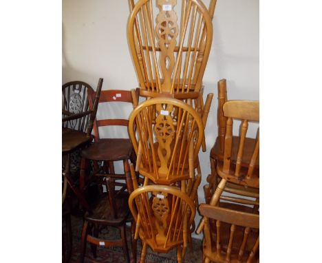 Set of six reproduction beechwood wheel and stick back dining chairs, together with a small pine refectory style dining table