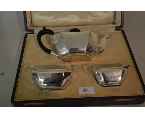 Early 20th Century silver three piece tea service by Asprey and Co. of irregular tapering octagonal form with shaped handles,