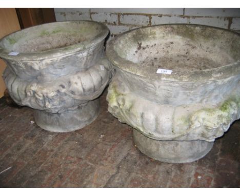 Pair of circular cast concrete garden planters relief moulded with lion masks