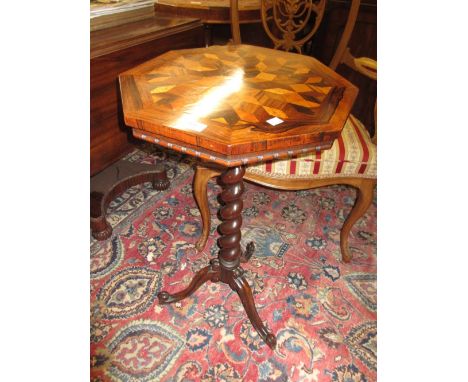 Victorian rosewood and parquetry inlaid octagonal pedestal table, the specimen wood top above a barley twist column support a